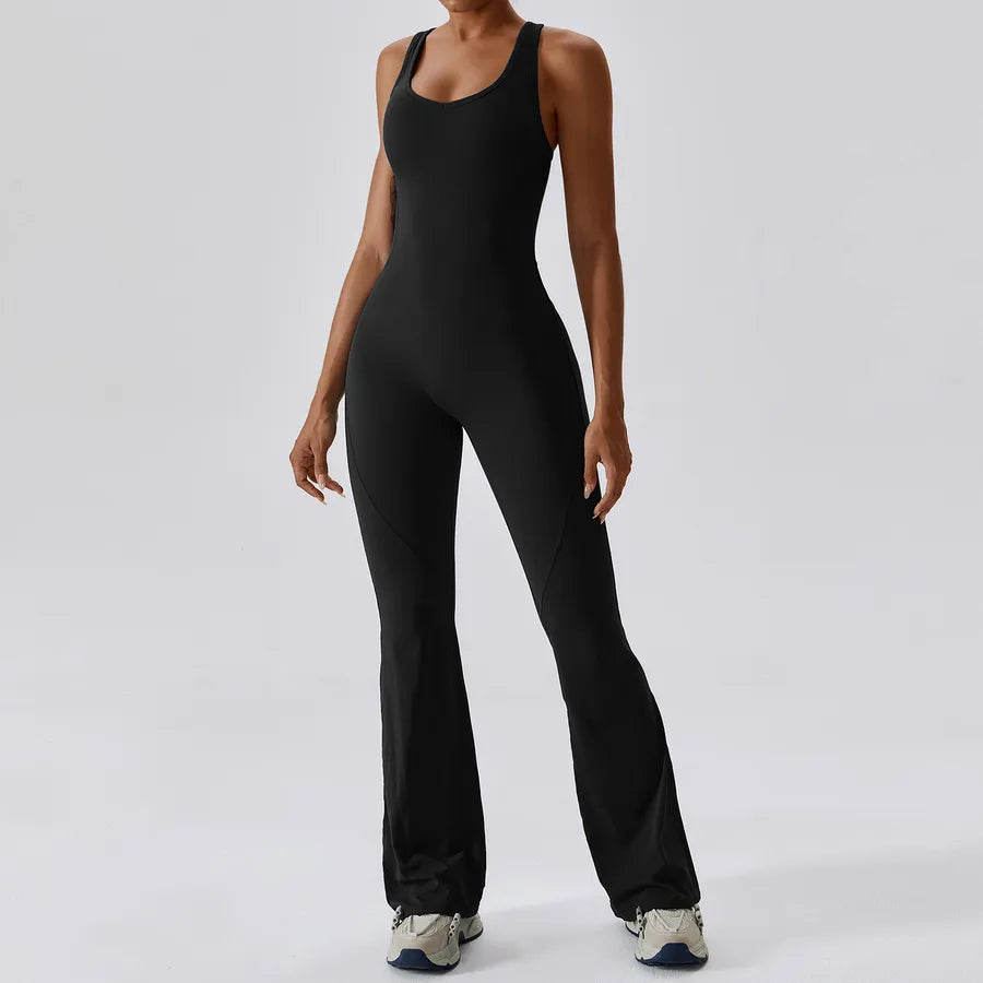 Person wearing a black jumpsuit on a white background