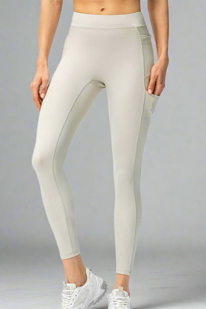 White leggings worn by a person on a white background